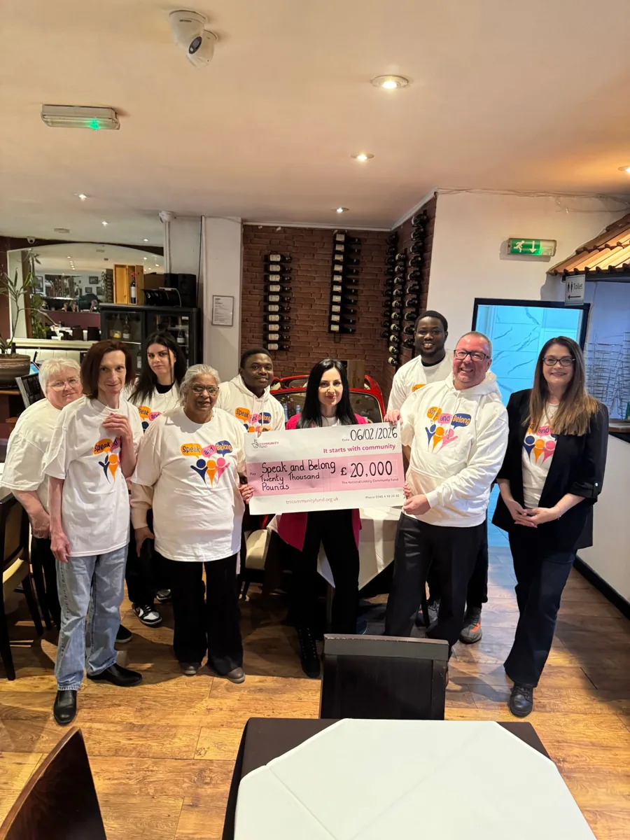 The Speak and Belong team with a £20,000 Community Fund cheque